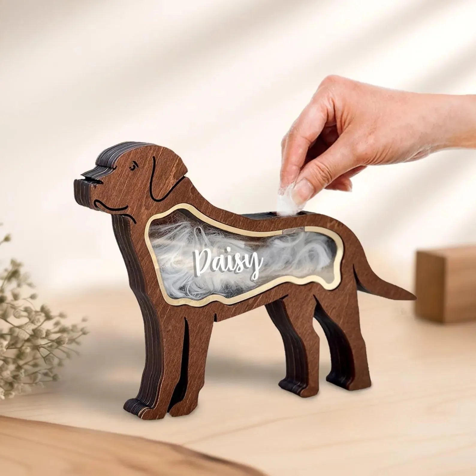 Black wooden pet hair storage box for organising grooming tools and accessories.