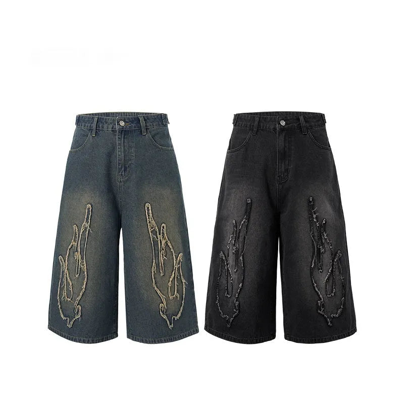 Men's cropped denim shorts with flame embroidery patches in straight cut design for summer street style