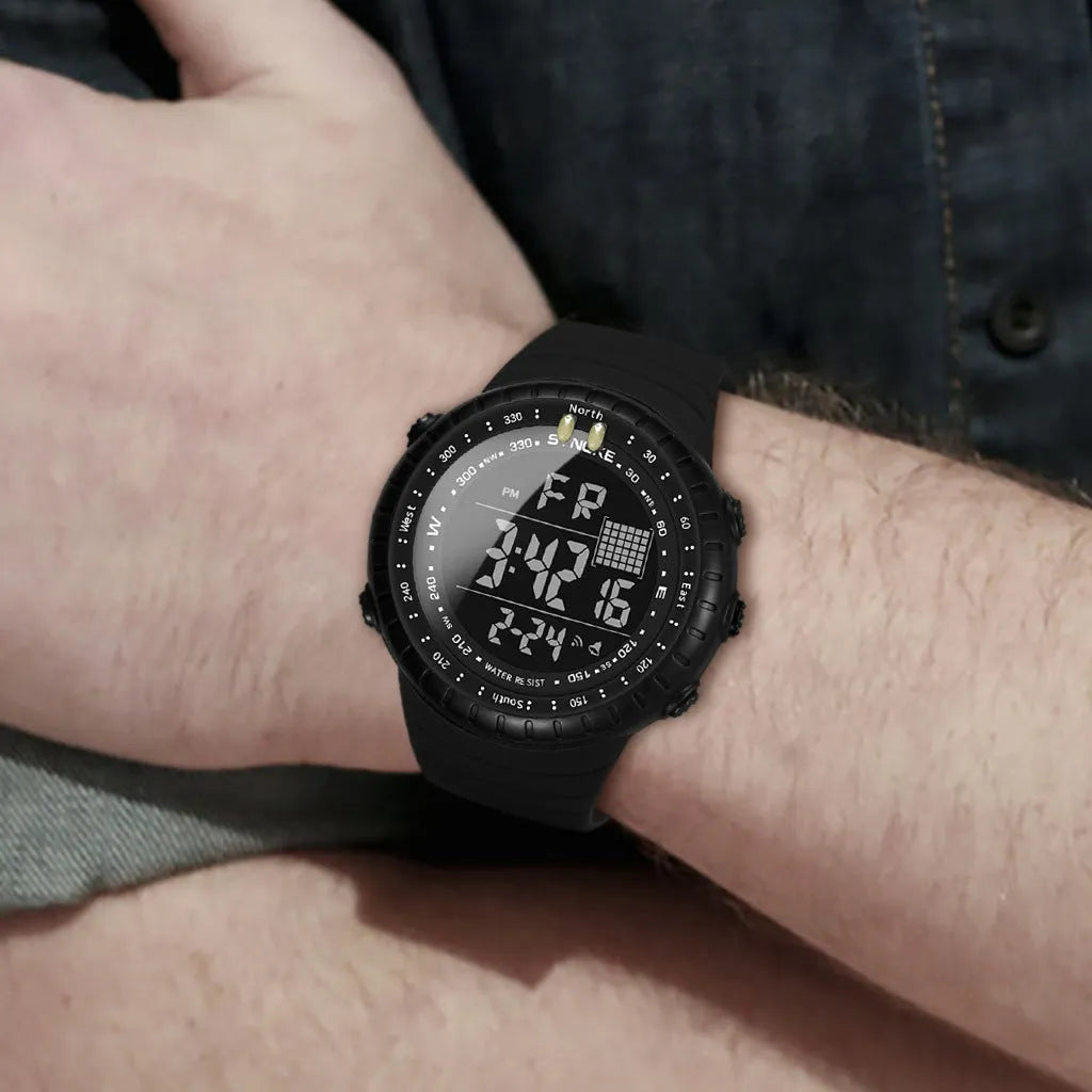 Black digital outdoor watch with large dial and PU strap on a wrist.