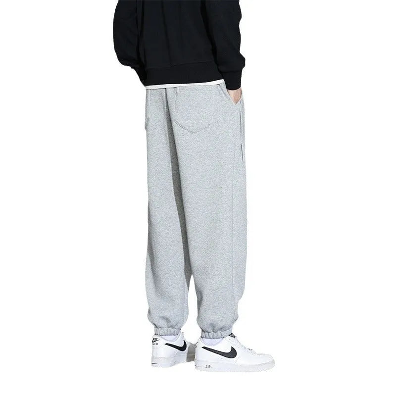 Men's loose fit cotton-polyester sports trousers in grey with elasticated waistband