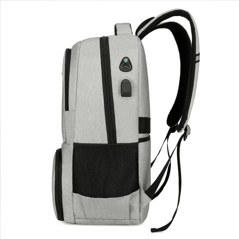 Light grey Oxford cloth insulated backpack with curved shoulder straps and a pull rod belt attached.