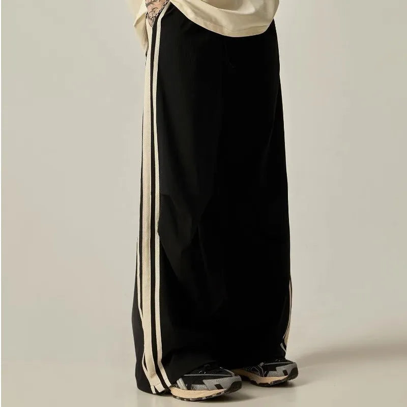 Black men's wide leg high-waist trousers with a straight-leg cut for summer casual wear.