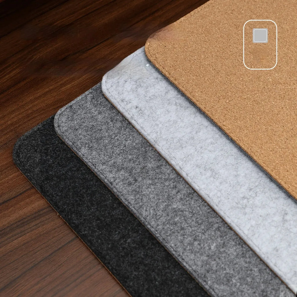 Winter warm felt cork office mouse mat with non-slip base in black and grey pattern on a desk.