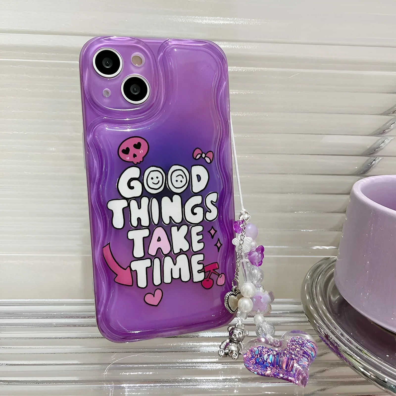 Purple English graffiti love pendant chain on a transparent TPU iPhone case.