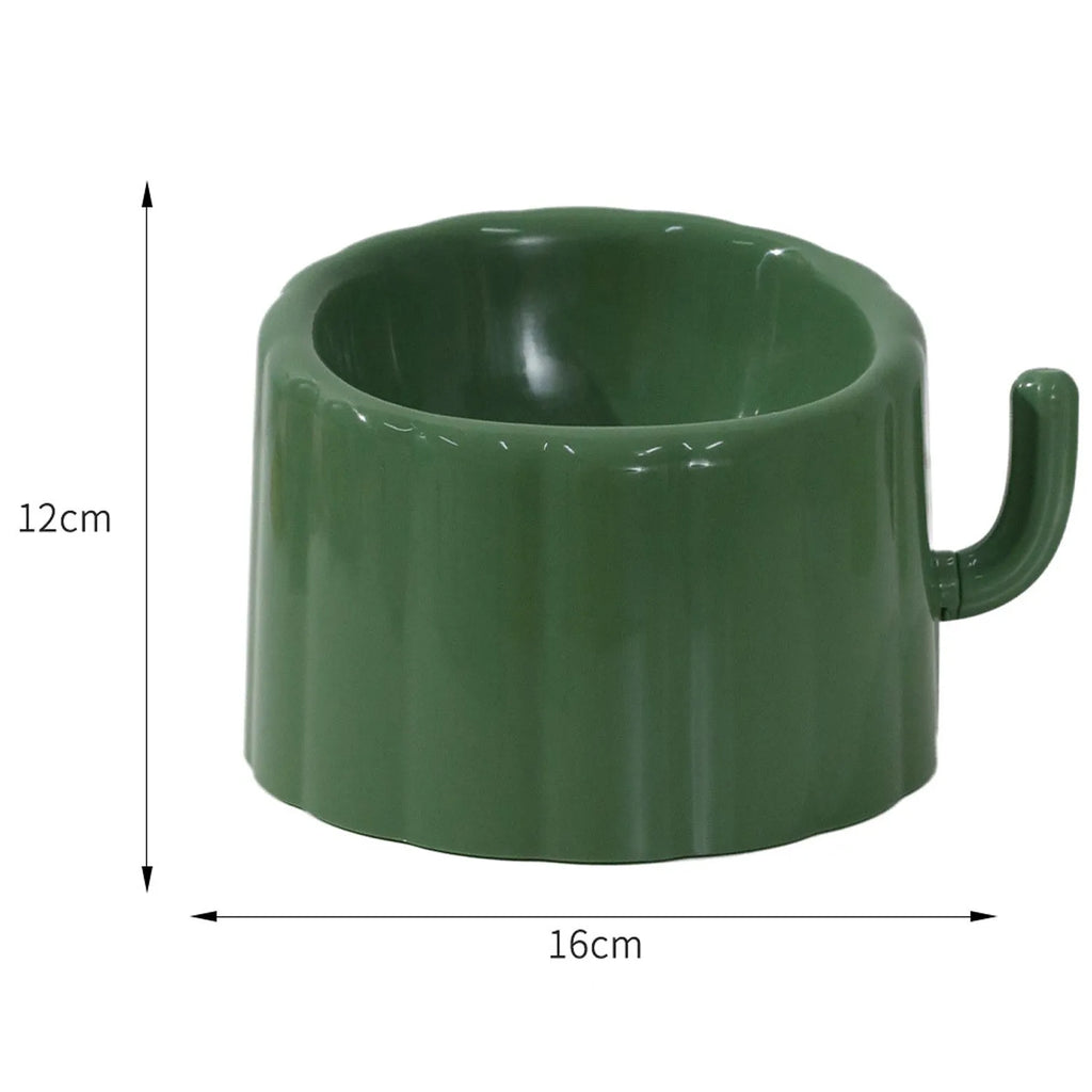 Dark green cat bowl with cactus design and anti-slip base on a wooden surface.
