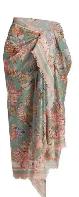 Women's floral print bikini set with top, briefs, and removable skirt in creamy-white colour