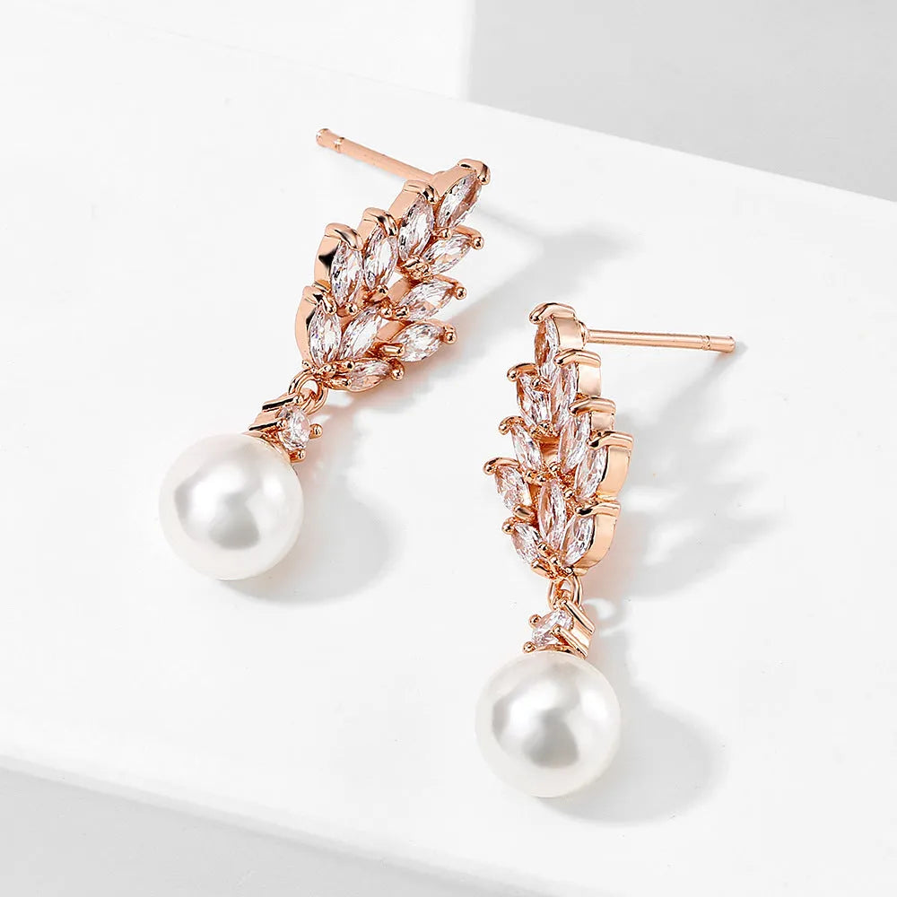 Geometric flower earrings with micro inlaid zircon stones in gold, platinum, or rose gold plating.