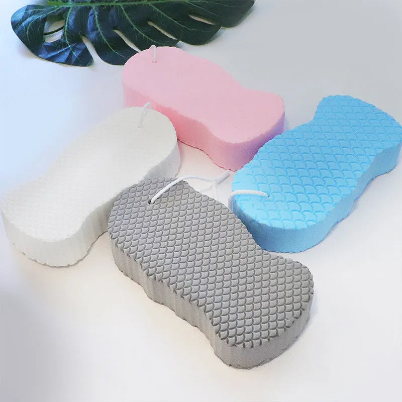 White 3D fish scale pattern bath sponge ball for gentle body exfoliation in the shower.
