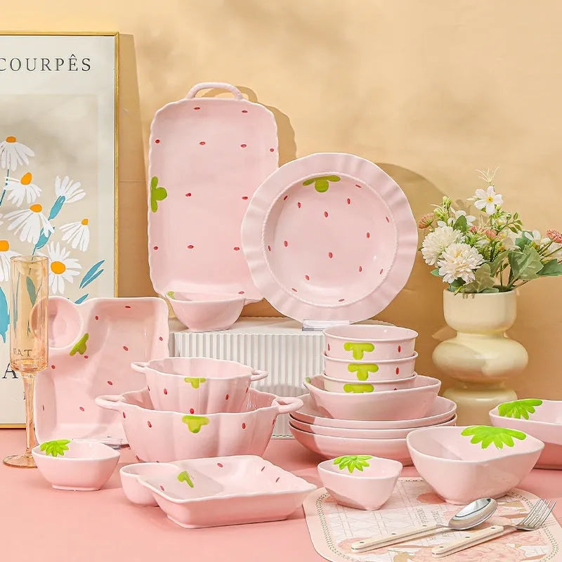 Strawberry design porcelain dinnerware set with plates, bowls, and twist spoon