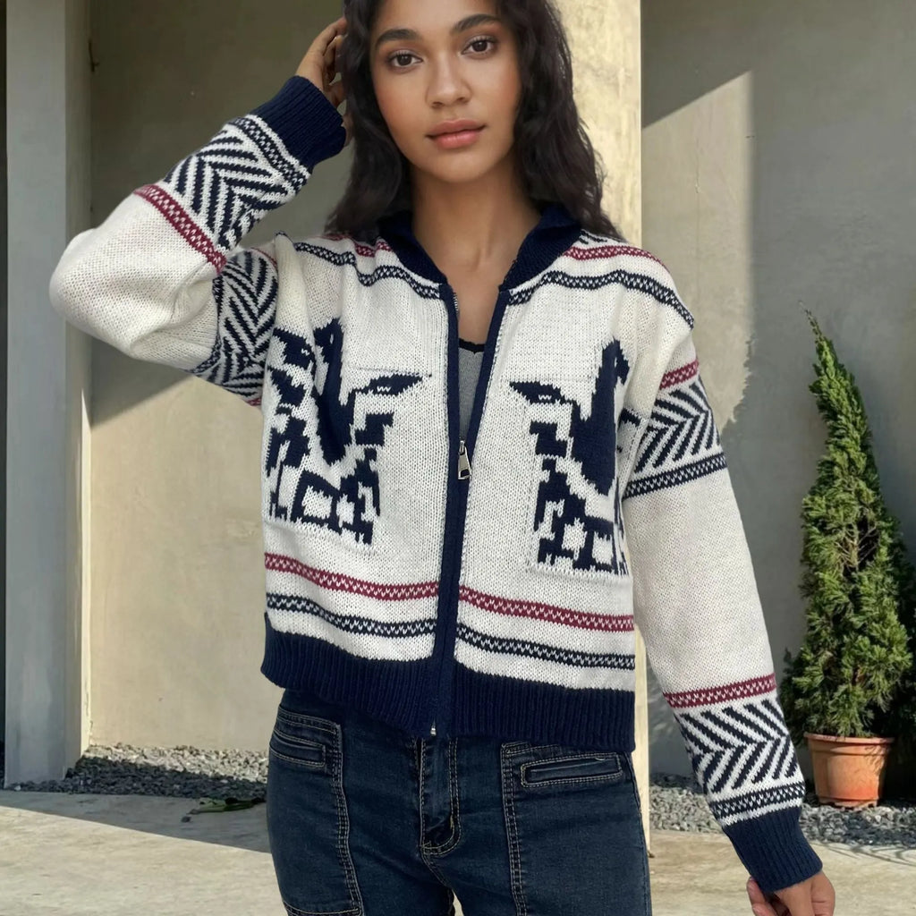 White women's cardigan with front zipper, lapel collar, and contrasting stripe jacquard pattern.
