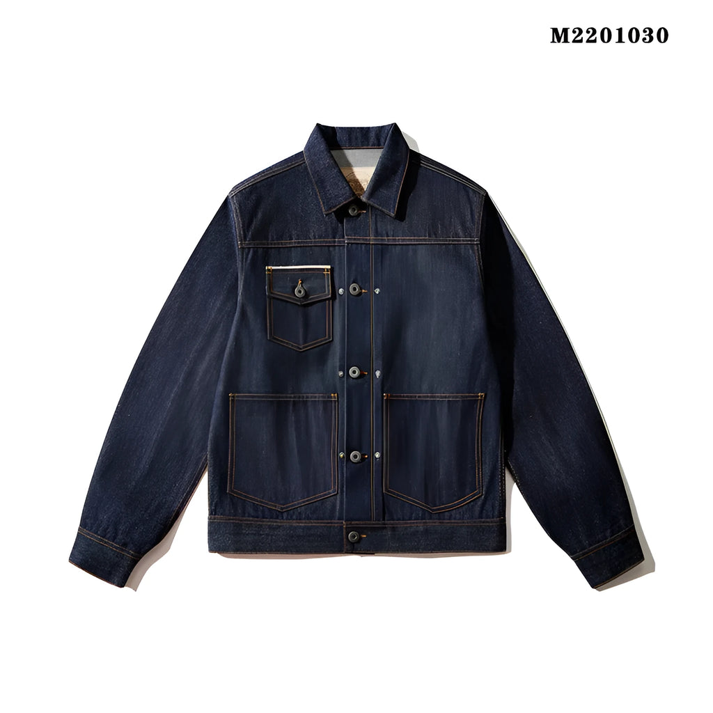 Man wearing a raw pulp coloured loose Japanese-style cotton jacket with red edge trim and patch pockets.
