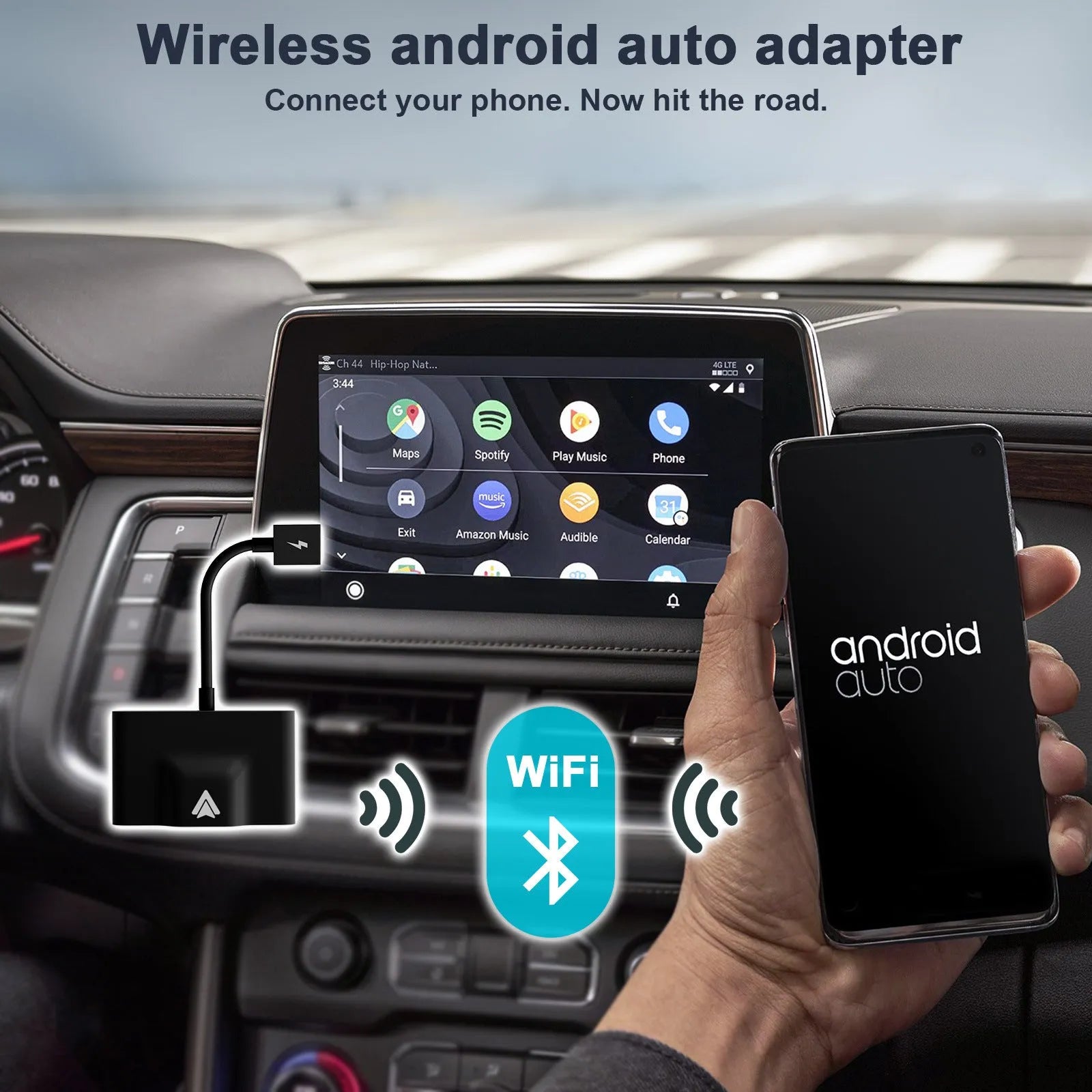 Black and white wireless Carplay adaptor for Android phones next to a car steering wheel