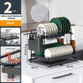 White double-layer kitchen storage rack with removable draining components on countertop