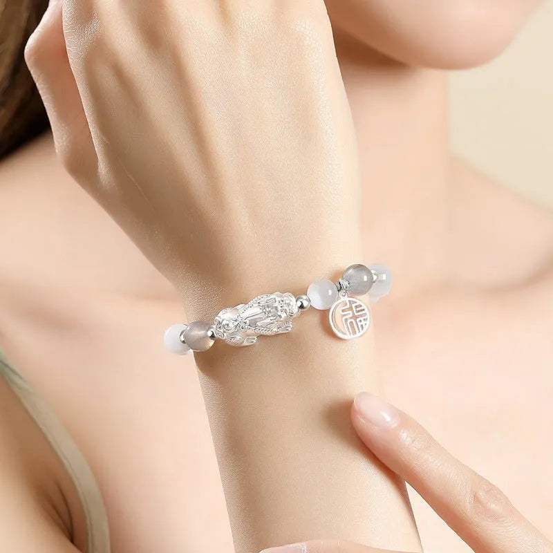 Hand-woven 999 sterling silver couple bracelet set with animal elements and tassel details