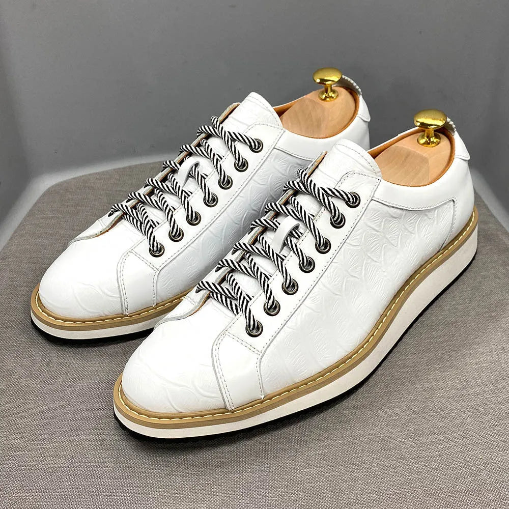 Low tube handmade men's shoes with an embossed pattern, shown in black with front-tie laces.