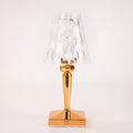 Rose gold portable touch control bedside night light on a wooden surface