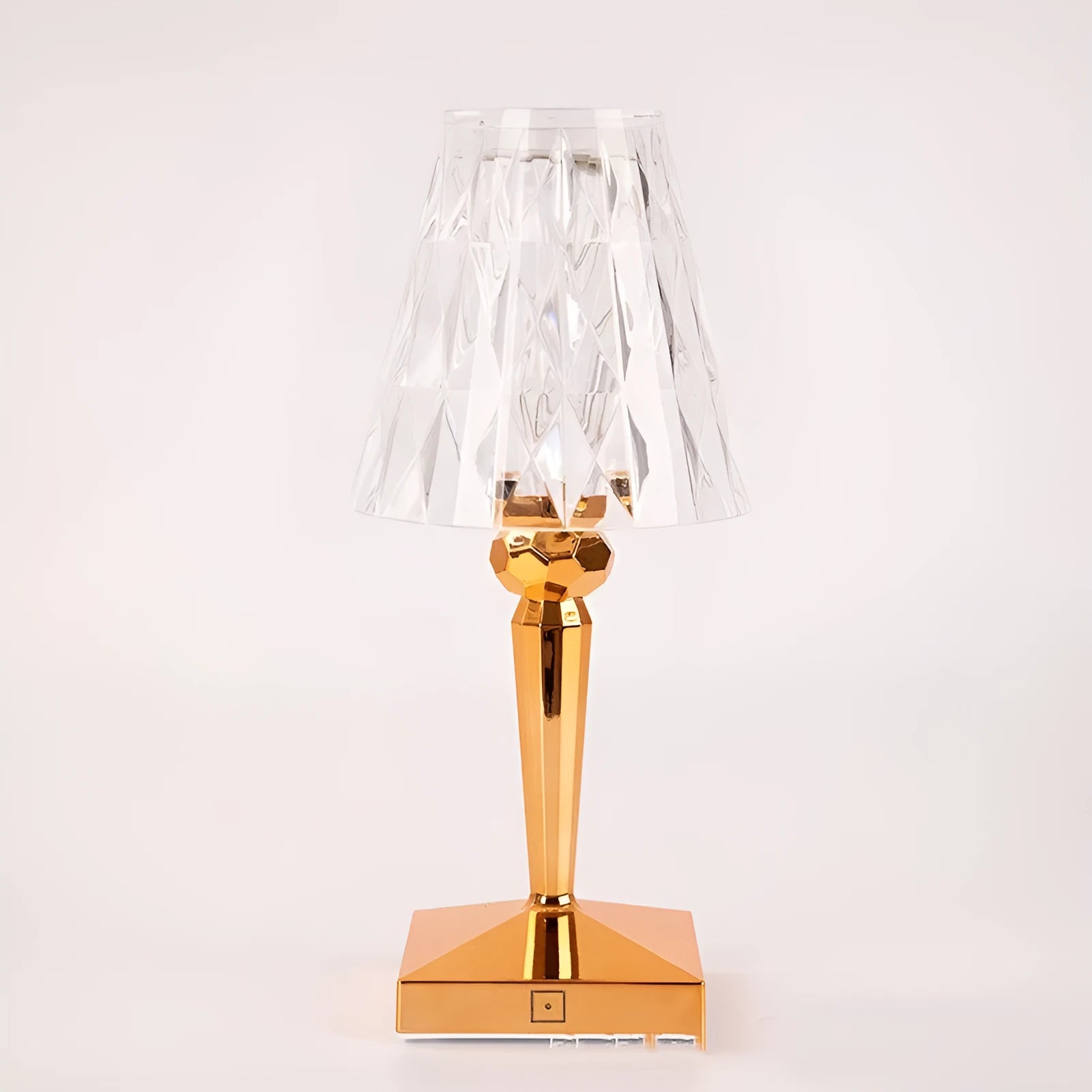 Rose gold portable touch control bedside night light on a wooden surface