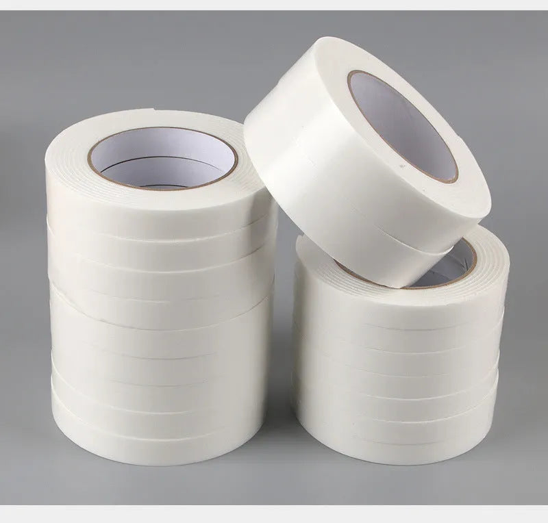 Foam double-sided adhesive tape roll showing 3mm thickness with measurements for 15mm, 18mm, and 30mm width options