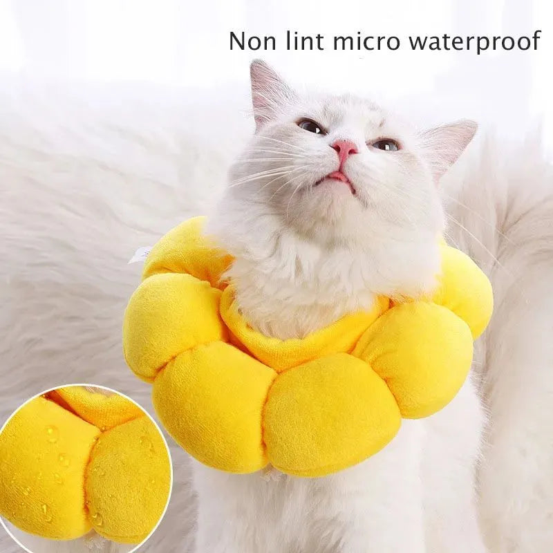 Soft white cotton pet protective collar for cats and dogs on a table, showing adjustable band and inner ring.