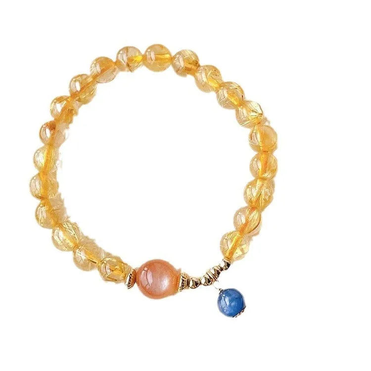 Women's gold rutilated quartz sunstone crystal bracelet with diamond-shaped beads