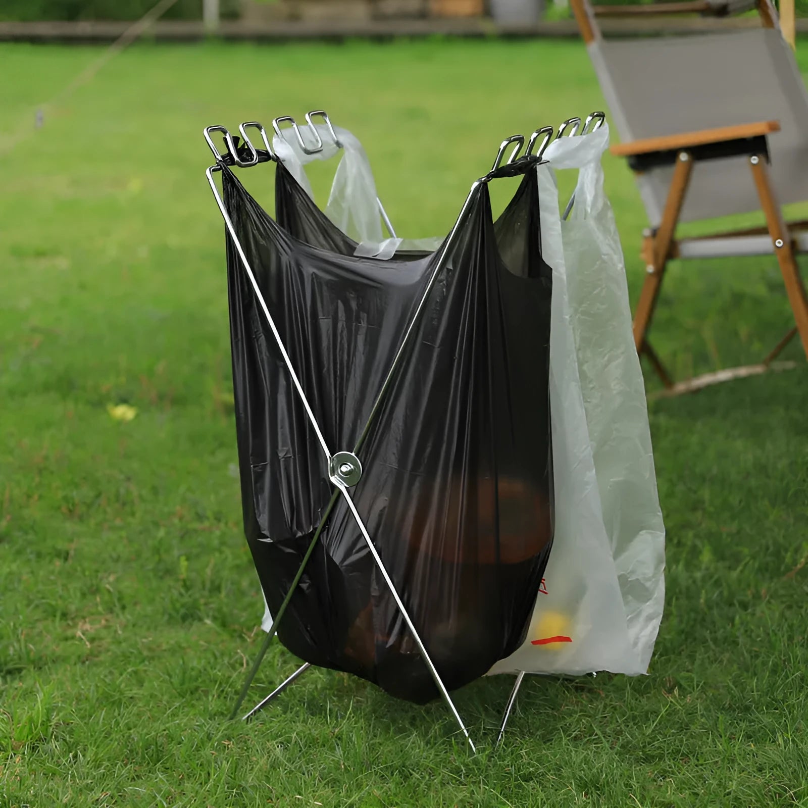 Stainless steel folding garbage bag bracket in black and silver colours for camping use