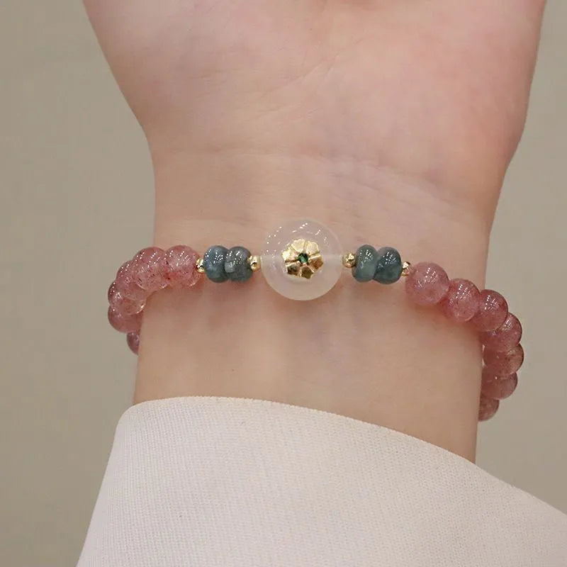 Women's strawberry quartz and blue water emerald bracelet with round jade pendant and geometric design