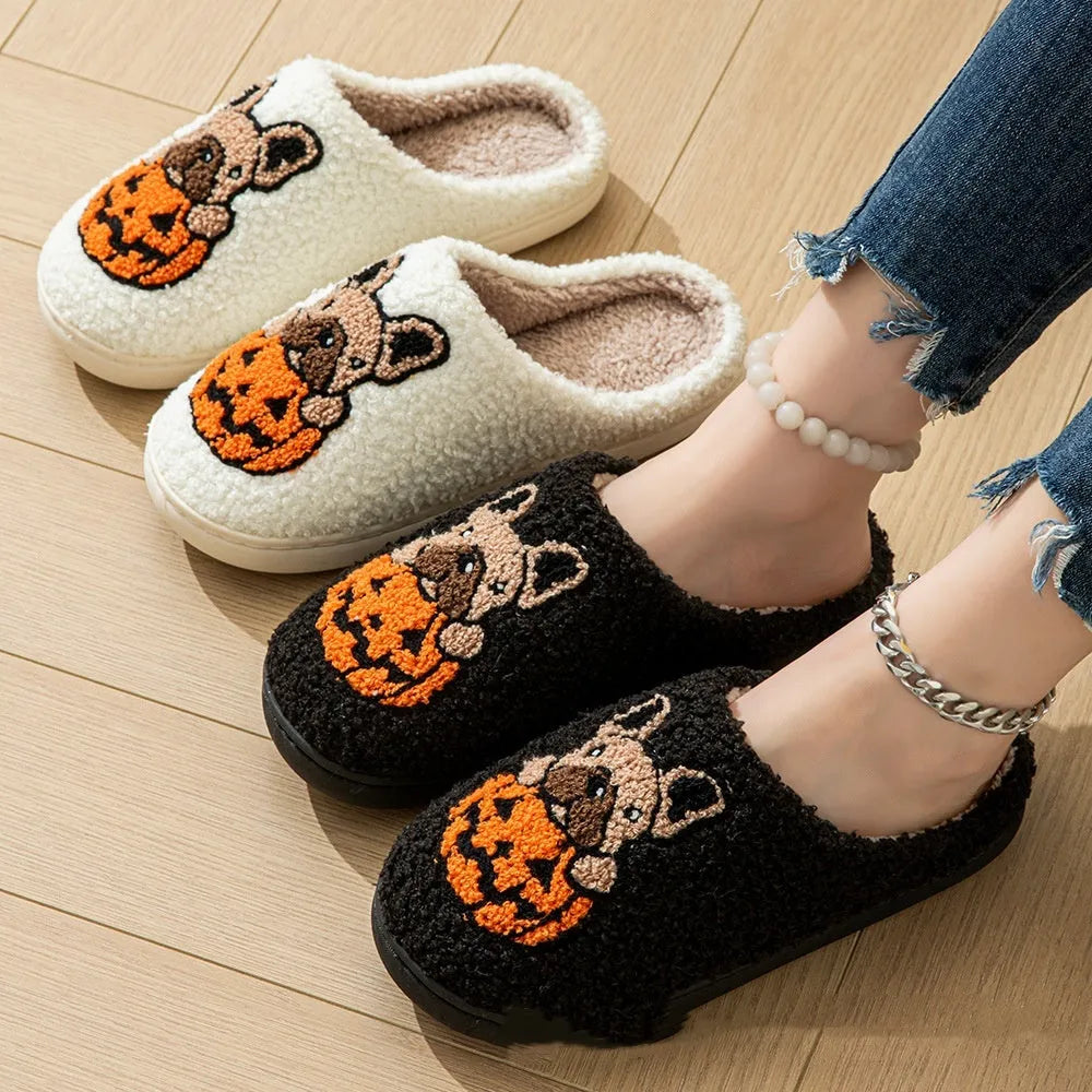 Black and white Halloween plush slippers with pumpkin design and non-slip rubber soles