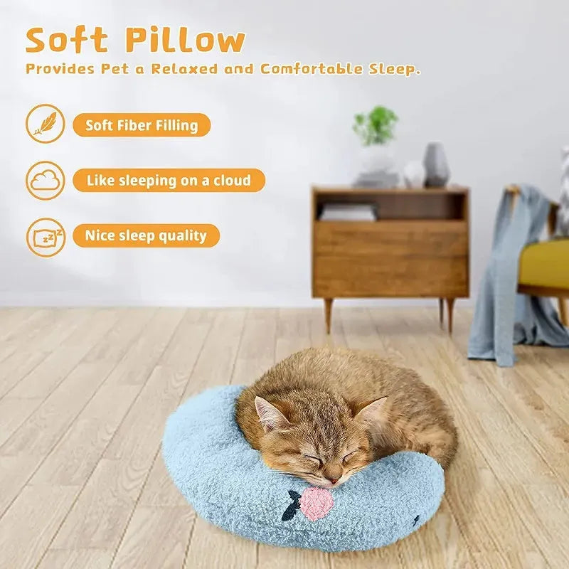 Blue U-shaped plush pet pillow for a small dog or cat, showing raised rim and quilted texture.