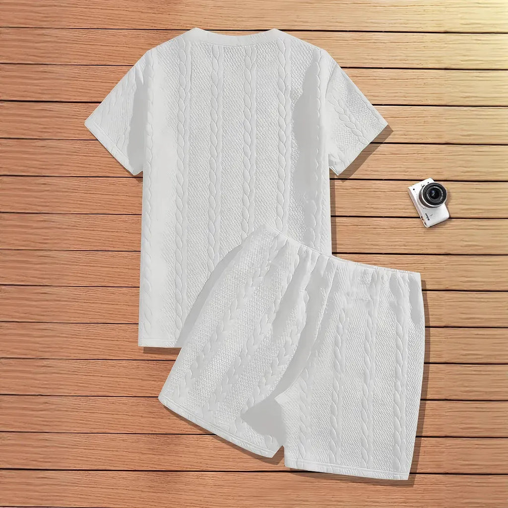 Men's black ribbed two-piece sports set with patch design on short sleeve top and matching shorts