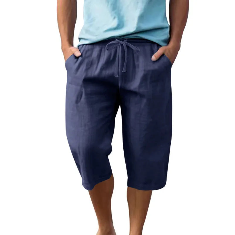 Men's loose fit linen shorts in light blue colour with a high waist and drawstring.