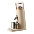 Portable electric coffee grinder with stainless steel body in beige retro style