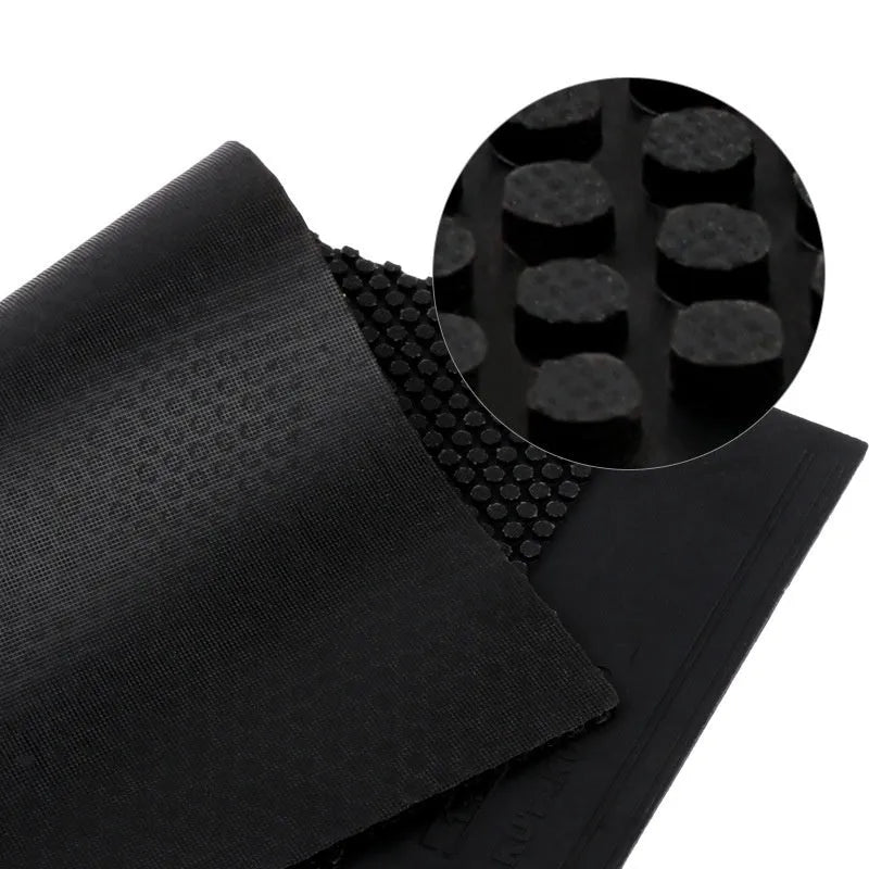 Single uncut sheet of black and red small particle table tennis rubber.
