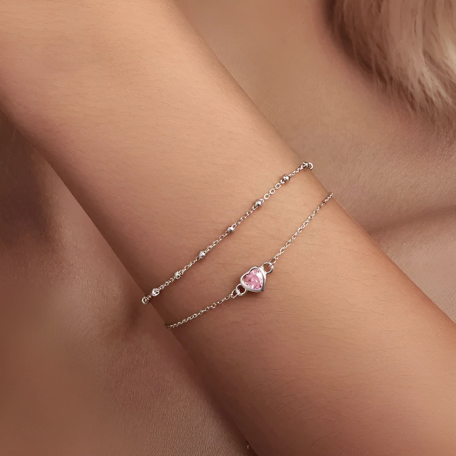 Sweet girlish heart-shaped 925 sterling silver bracelet on wrist, colour BSB152.