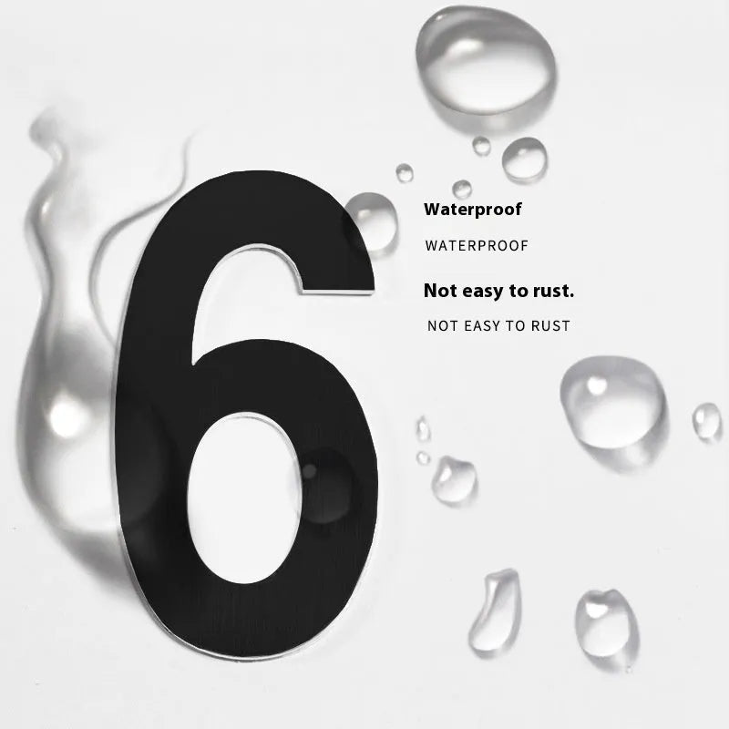 Black stainless steel sticky house number sign measuring 7.5cm with self-adhesive backing.