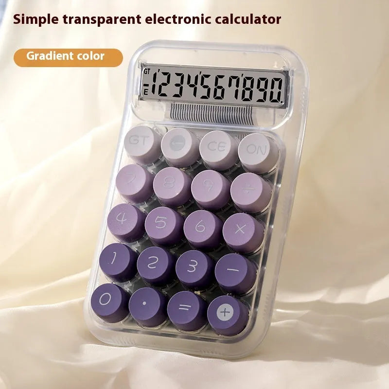Gradient colour mechanical keyboard calculator on a desk showing LCD display.