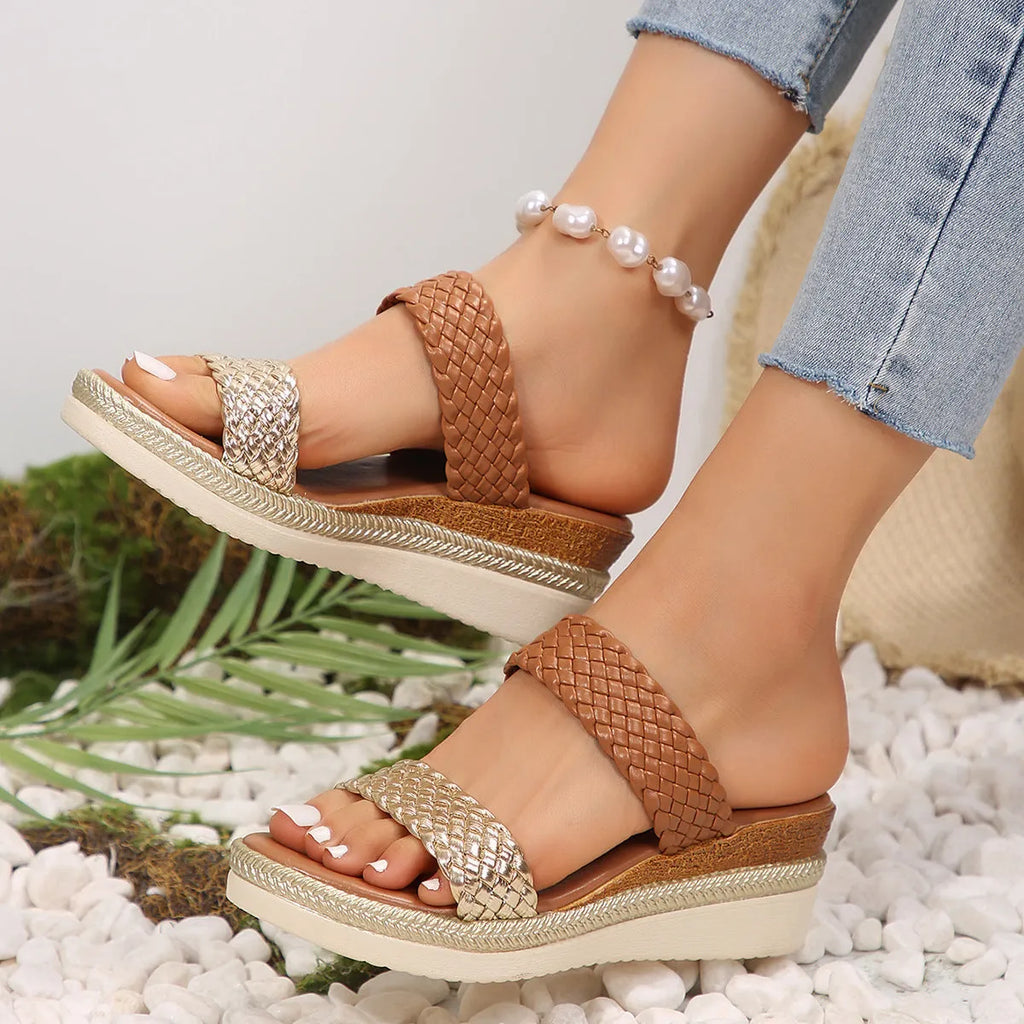 Gold wedge sandals for women with an adjustable ankle strap and a rubber sole.