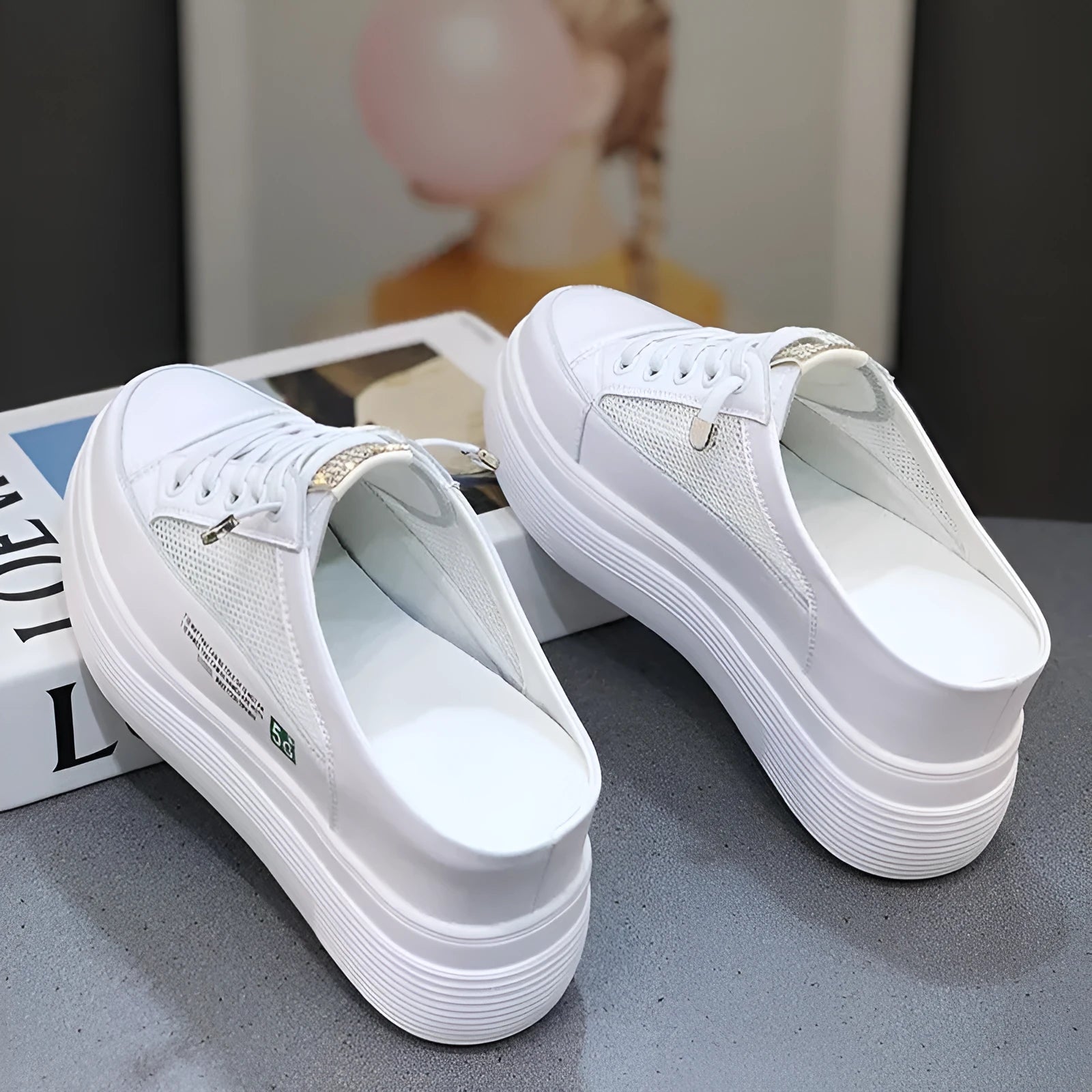 Women's white platform shoes with mesh surface detail and rounded toe