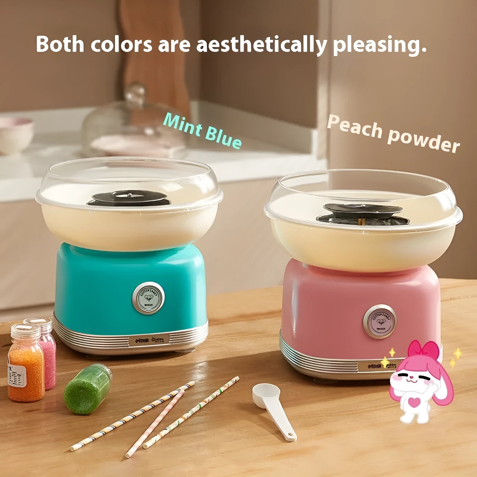 Pink mini electric cotton candy making machine with stainless steel body on a kitchen counter