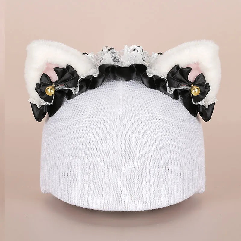 Plush fabric cute cartoon decoration hat placed on a ski helmet.