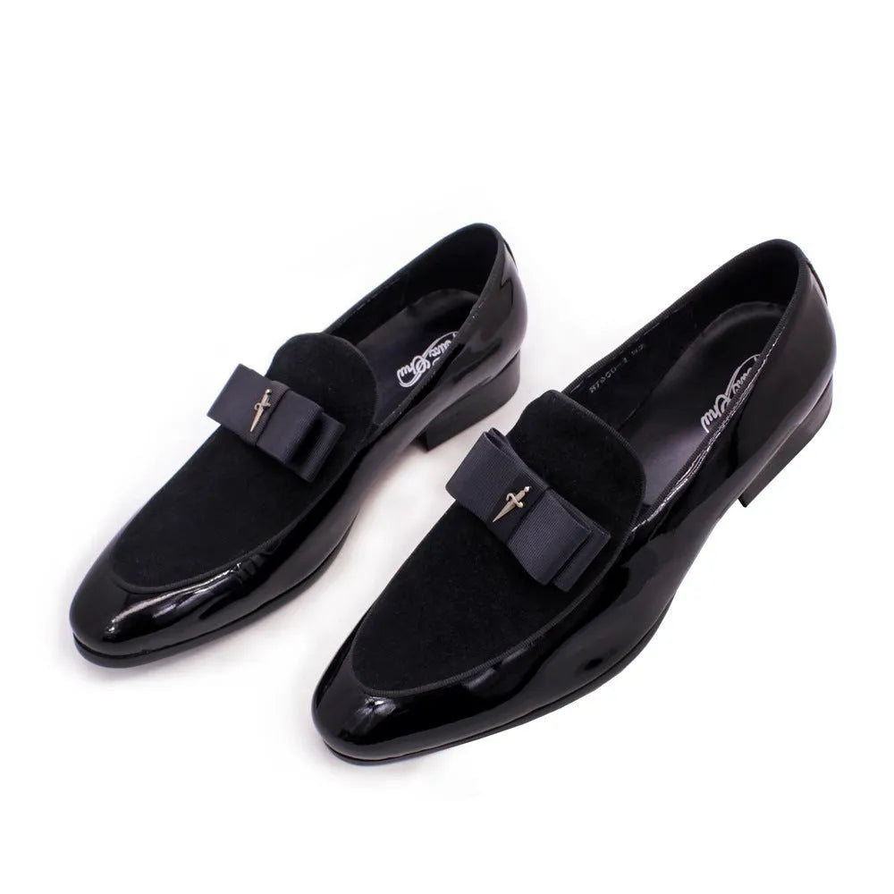 Men's black low-top leather brogue shoes with a patent leather finish and tassel detail on a rubber sole.