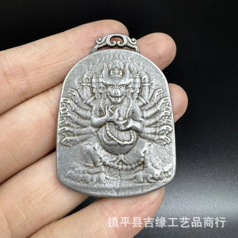 Close-up of iron hanging ornament pendant depicting Aryaacalanatha, Yamantaka in Chinese style.