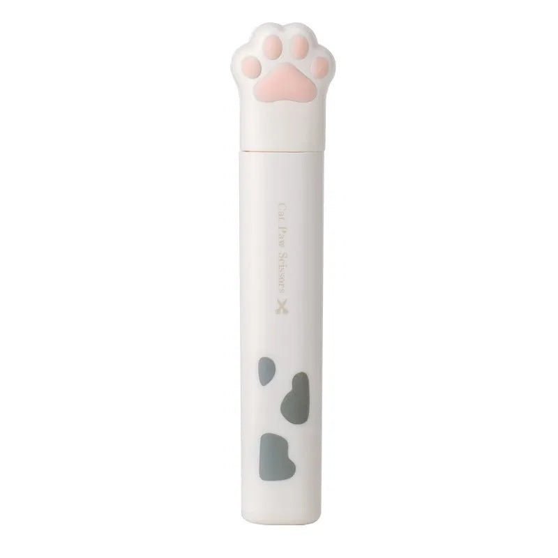 Closed and open views of cute cat paw design mini folding safety scissors on a craft background.