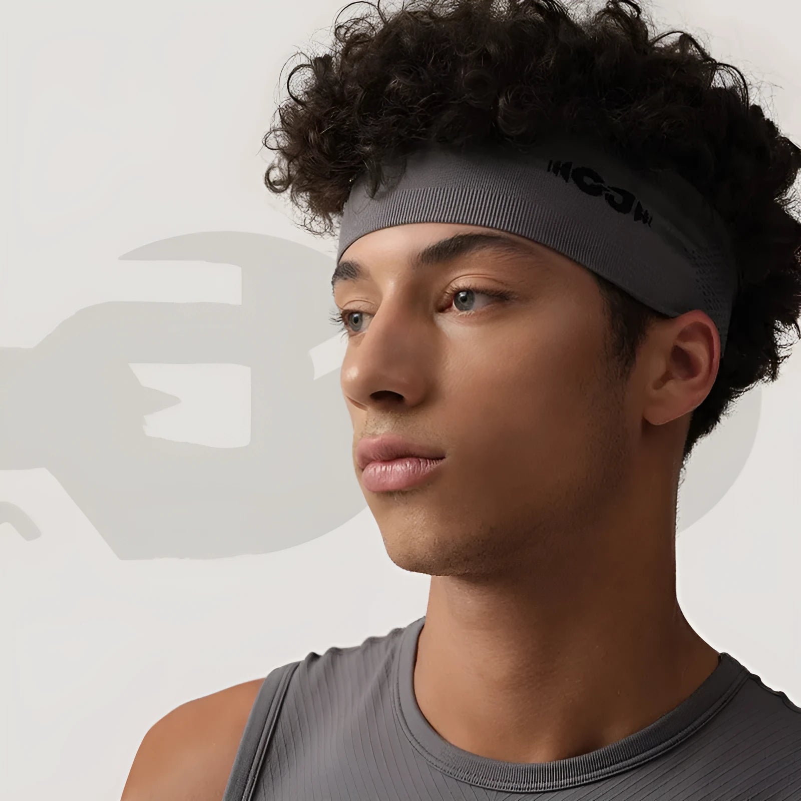 Seamless knitted exercise hair band in black, grey and blue colours for sports.