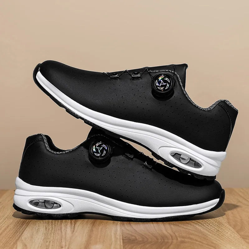 Low-top black and white mesh tennis shoes with cross-strap design and flat composite sole