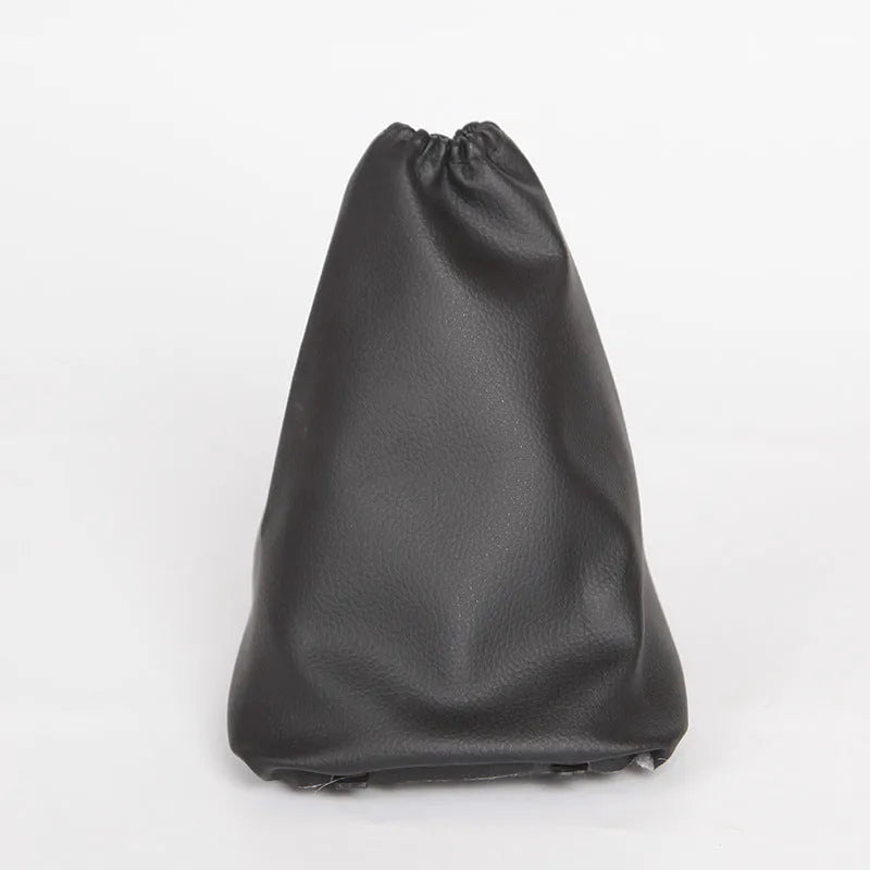 Black leather gear shift dust cover for Toyota Corolla measuring 15.2cm by 12.9cm