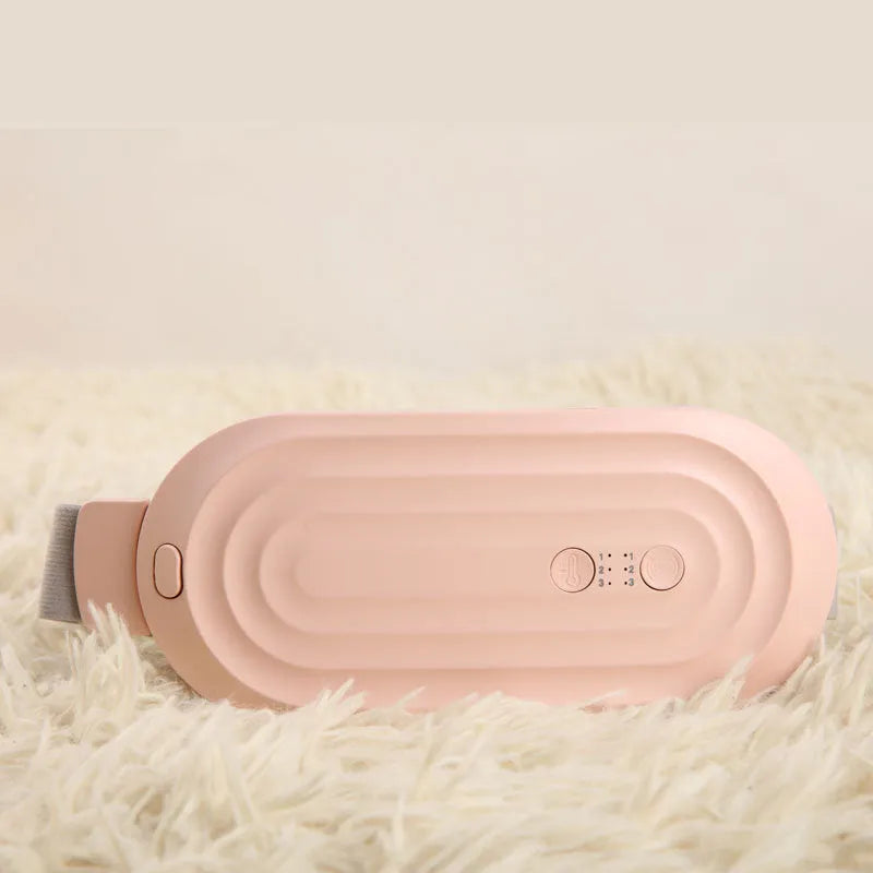 Pink electric menstrual heating pad with controller showing temperature display and vibration settings