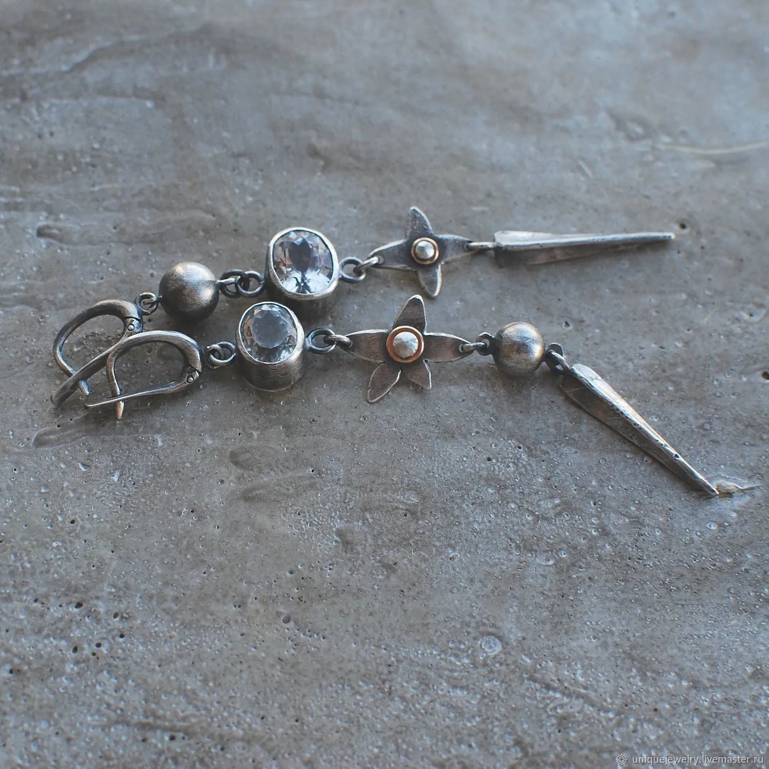 Geometric long XINGX pendant earrings in antique silver with rhinestone details on alloy.