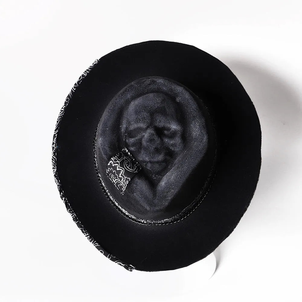 Handmade conical skull hat crafted from wool felt and denim fabric in a dark colour.