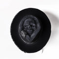 Handmade conical skull hat crafted from wool felt and denim fabric in a dark colour.