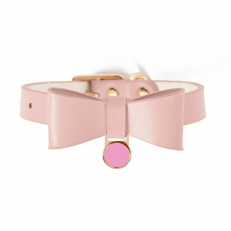 Brown leather cat collar showing buckle and adjustment holes on a neutral background